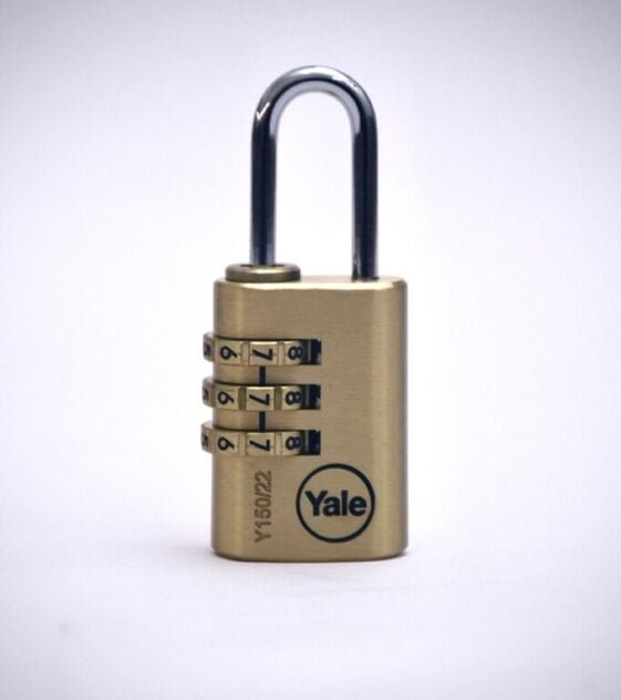 gold padlock on white surface